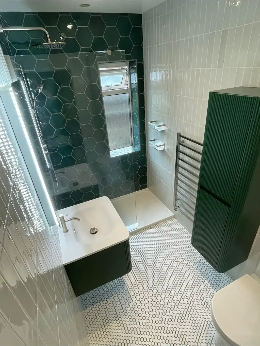 Dark gloss metro bathroom by Prestige Tiling