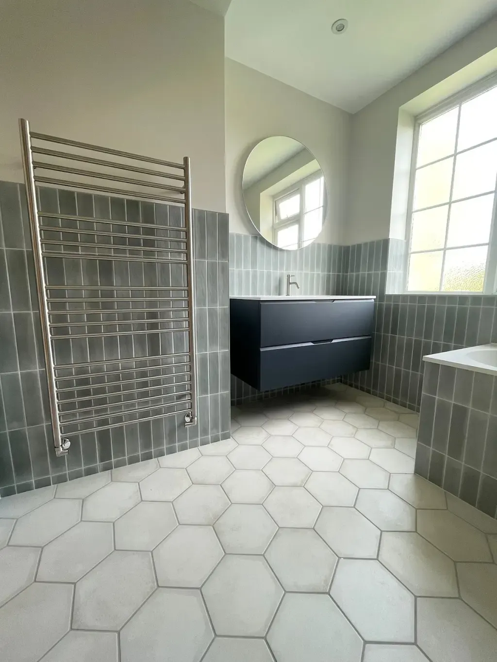 Grey bathroom tiling by Prestige Tiling