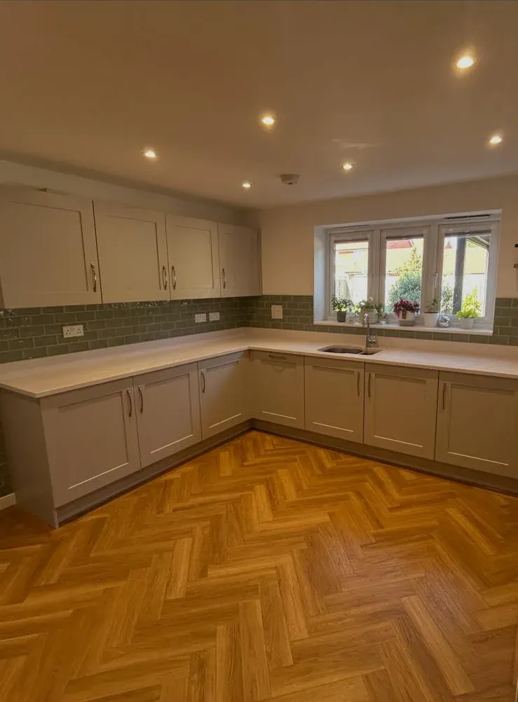 Wood-effect herringbone floor by Prestige Tiling