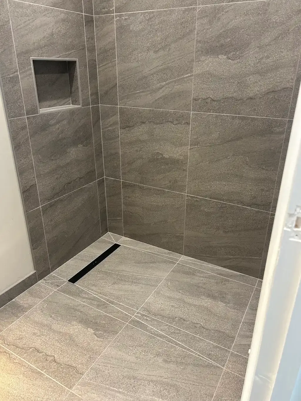 Level-access wet room by Prestige Tiling