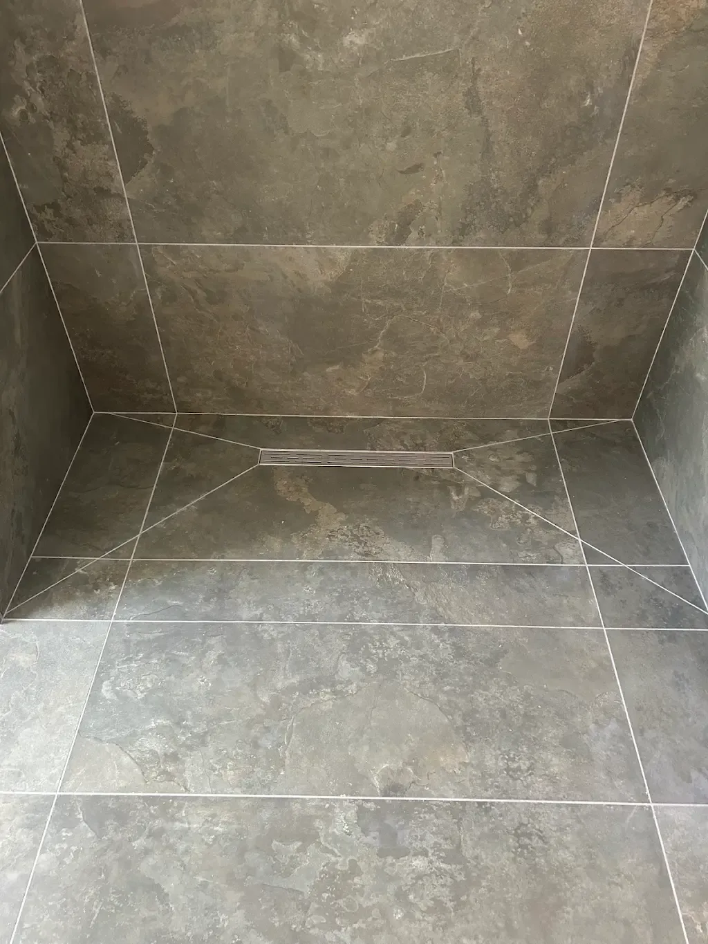 Marble-effect wet room by Prestige Tiling
